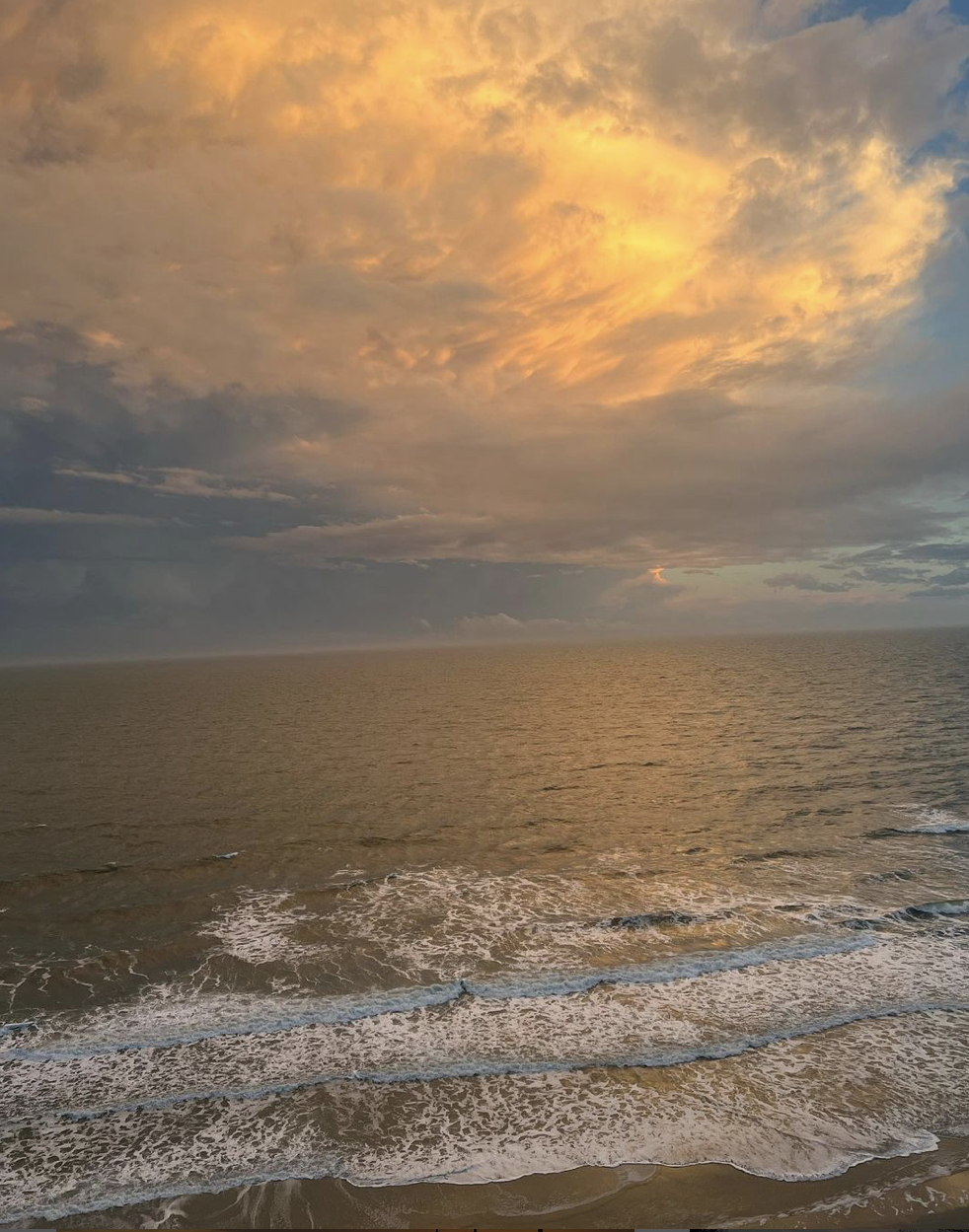 A picture of the beach during a sunset